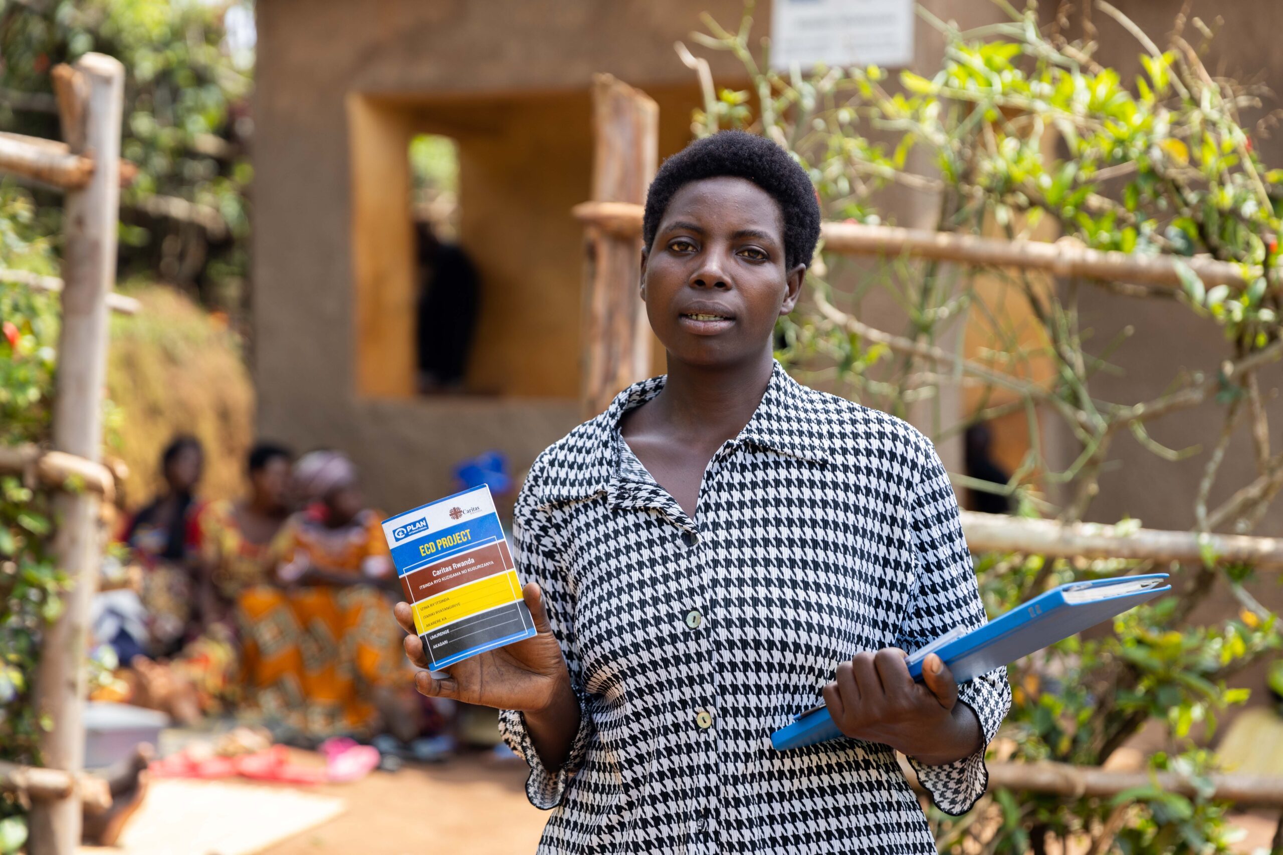 Adeline leads the savings group at her home-based Early Childhood Development Centre.