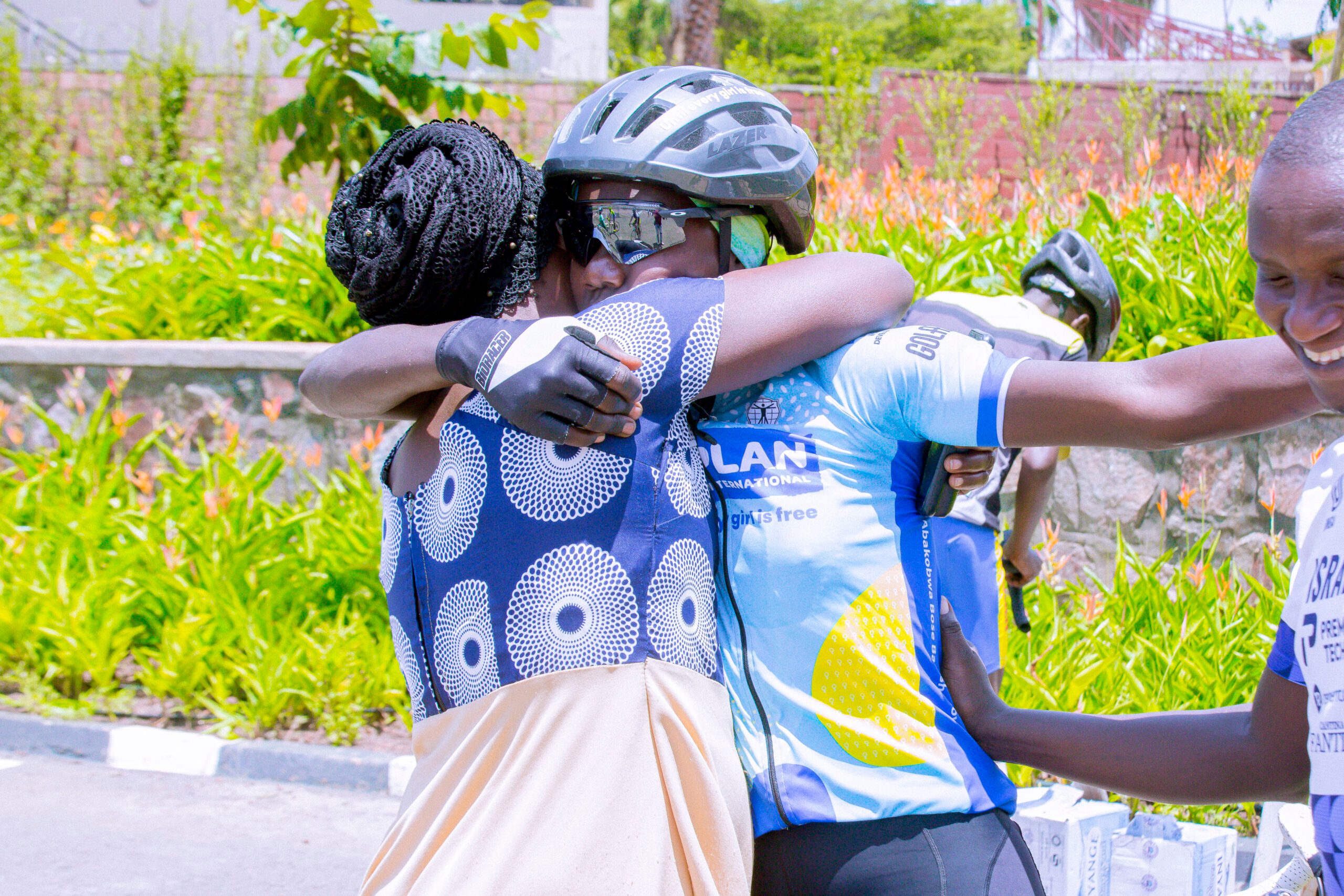 Amina and her mother share a joyful moment, their smiles reflecting their triumph.