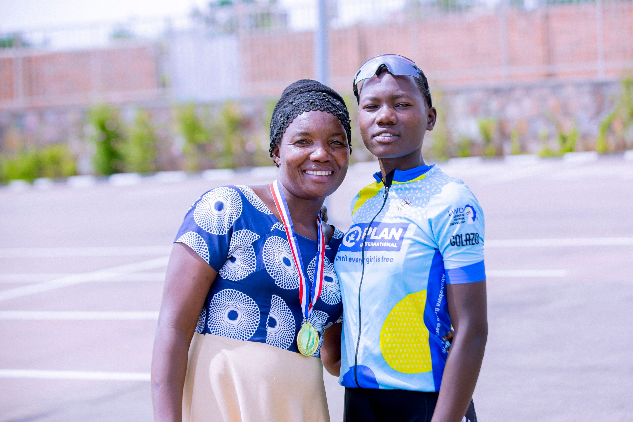 Amina joined by her mother, Beatrice, at a cycling competition.  