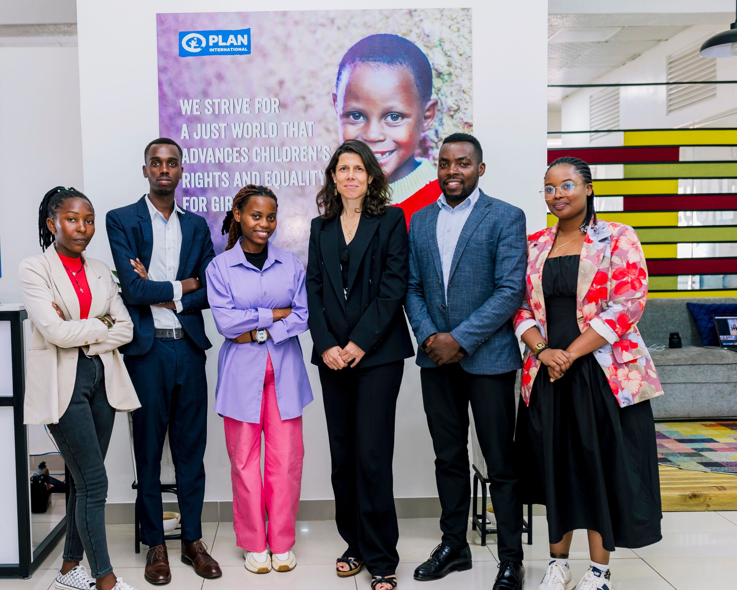Members of the Youth Advisory Panel with the Country Director in  a group photo.