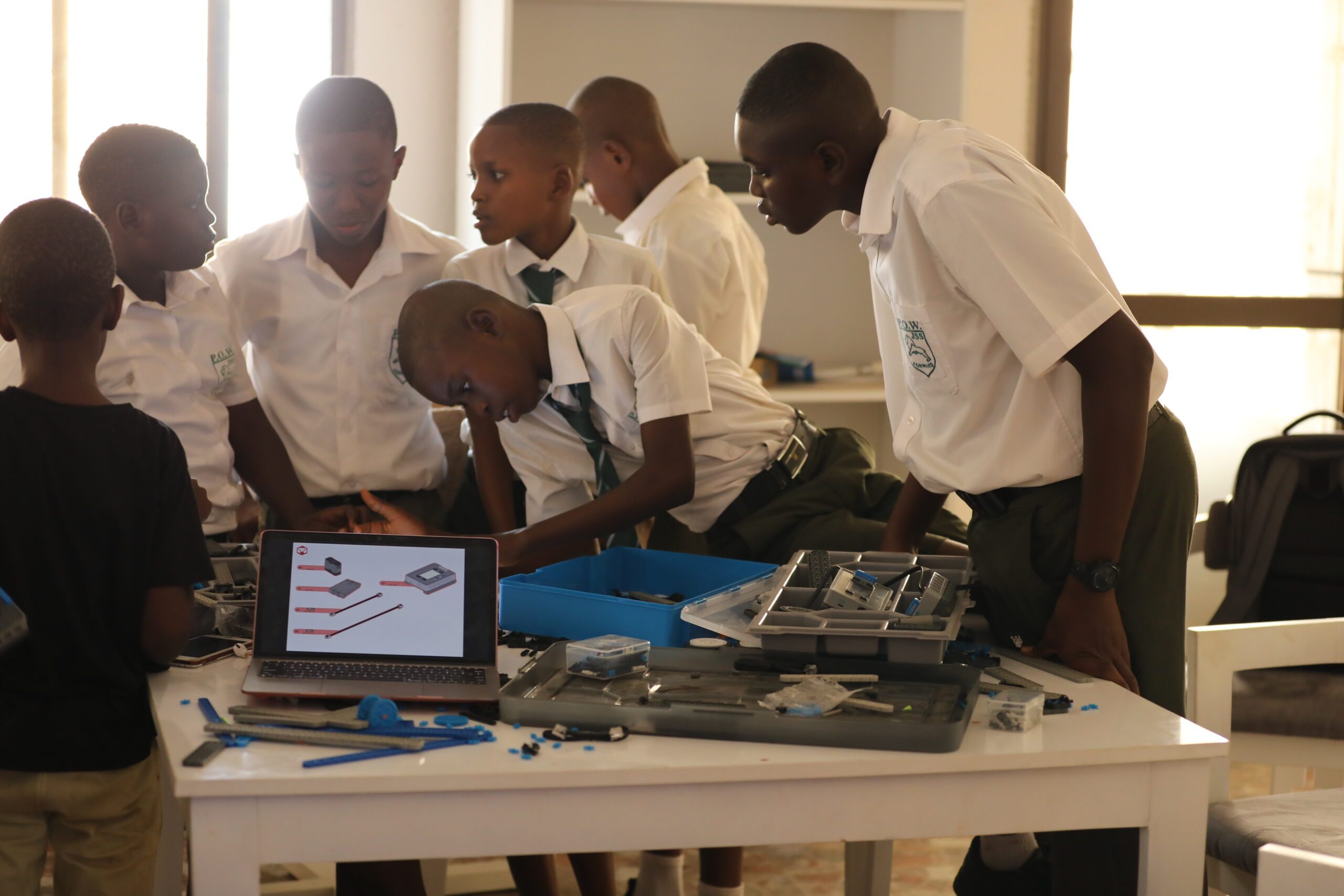 Boys building robots at the Kamara Yokie Innovation Centre