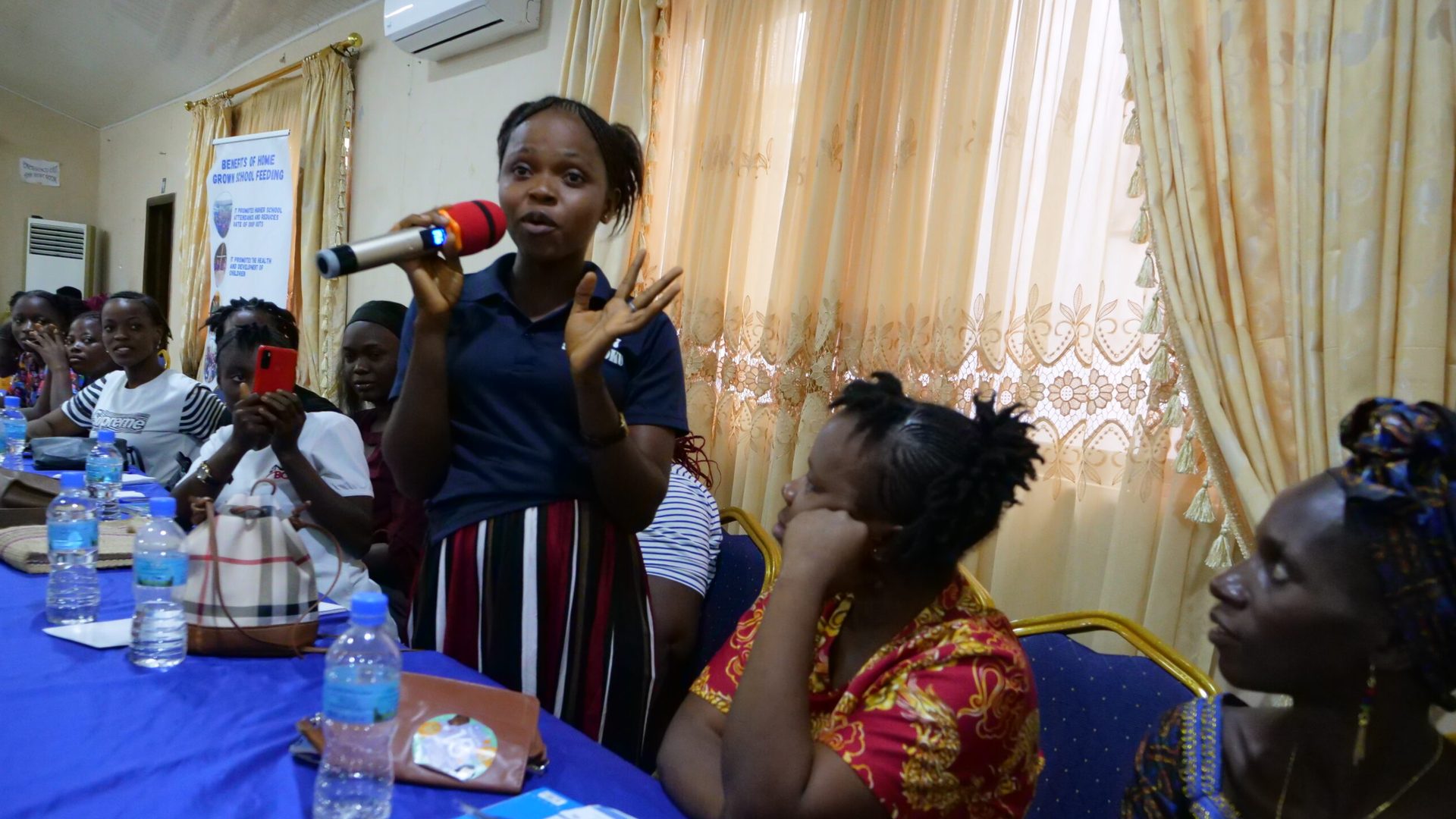 Young women speaking at the She Leads Conference,