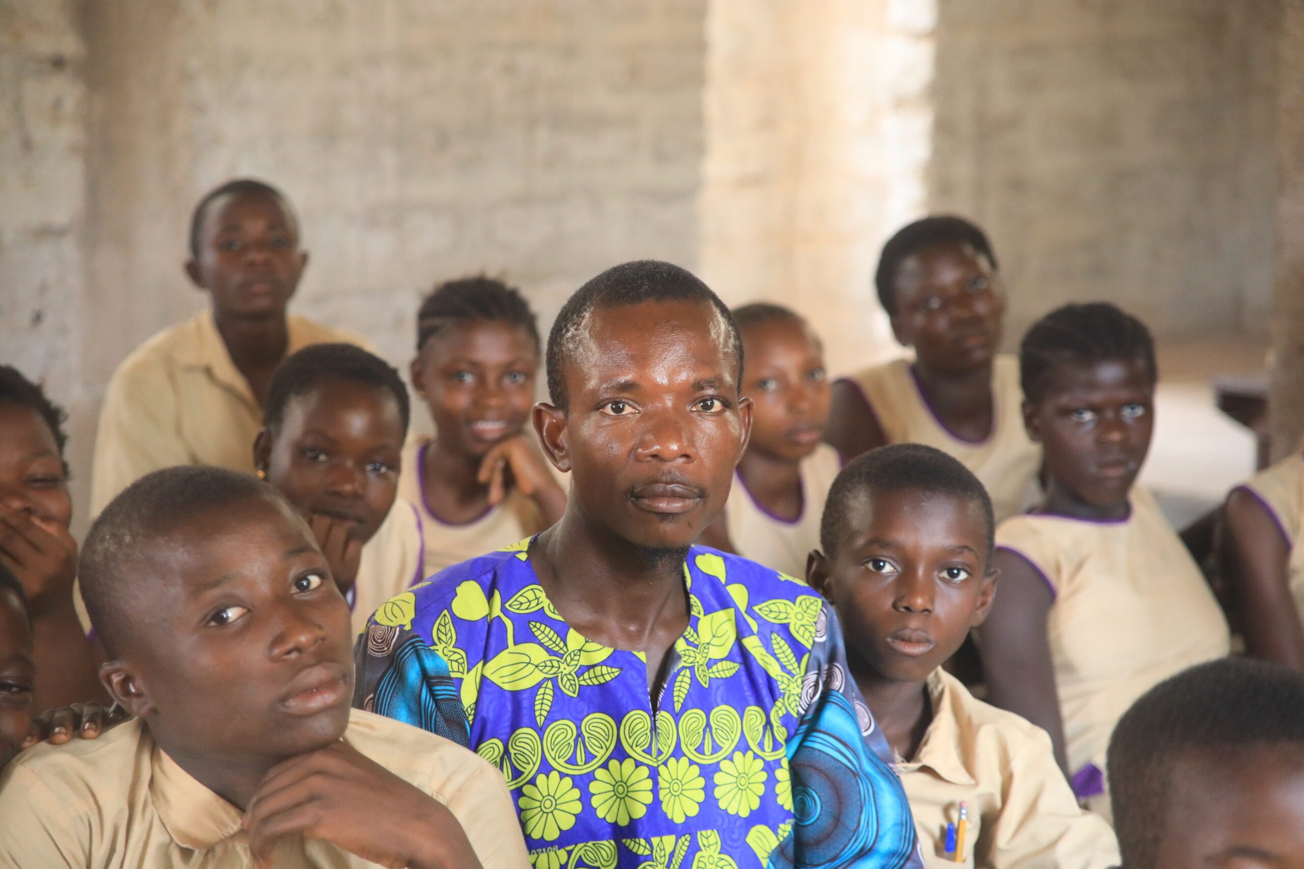 Gibrilla Kamara with his students in a classroom