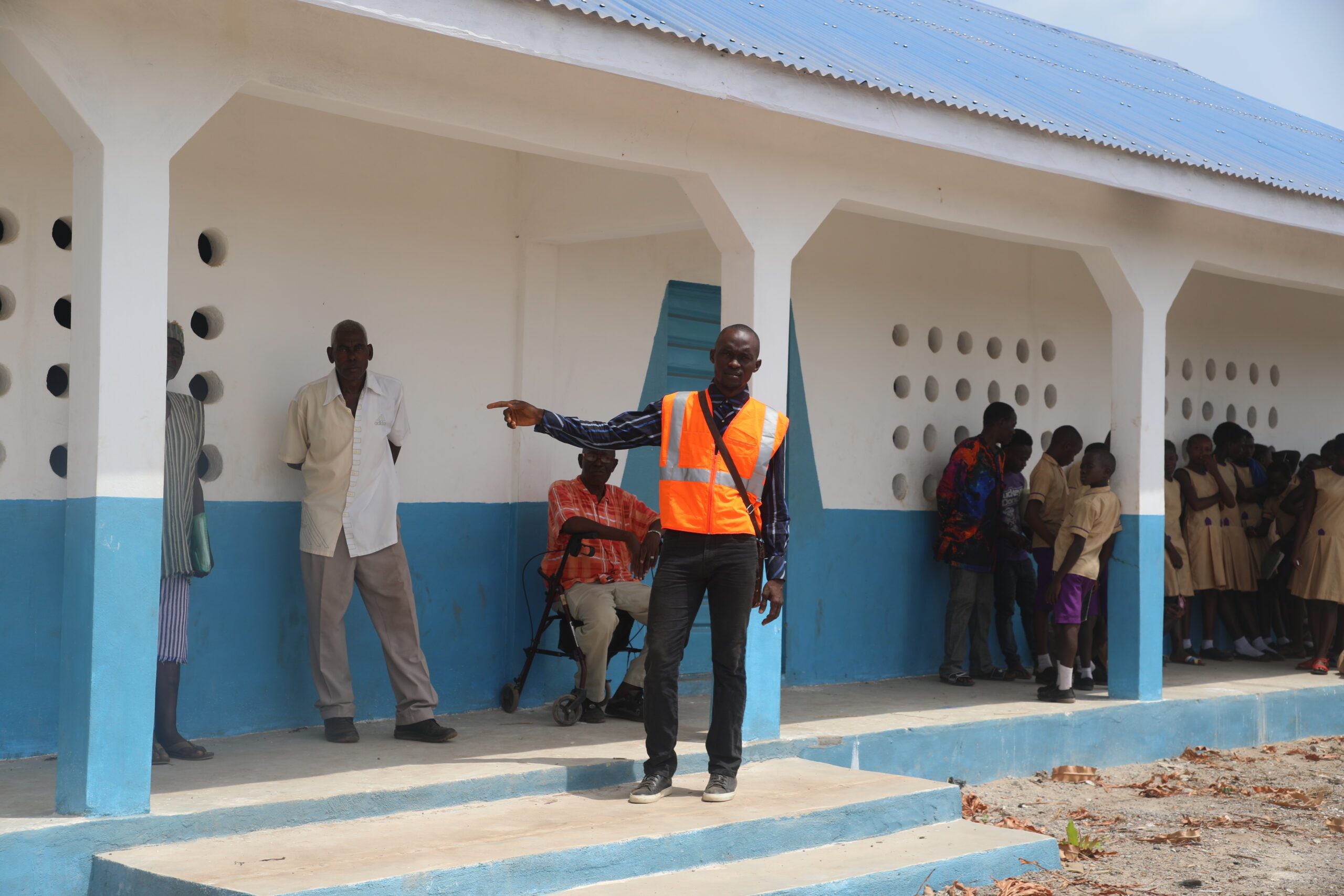 Aaron at a school he built