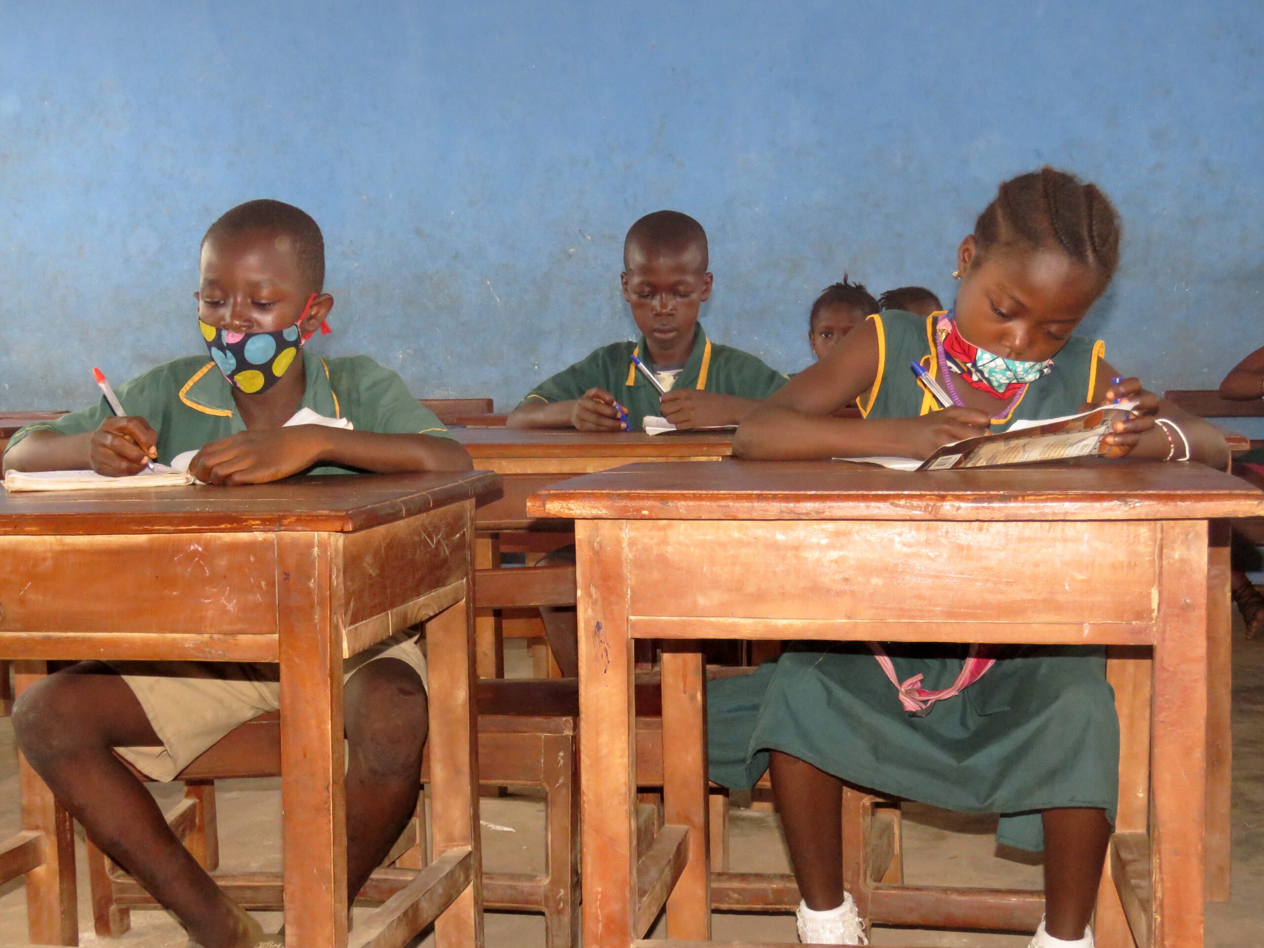Fatima, 11, and her friends learn in class at their new school