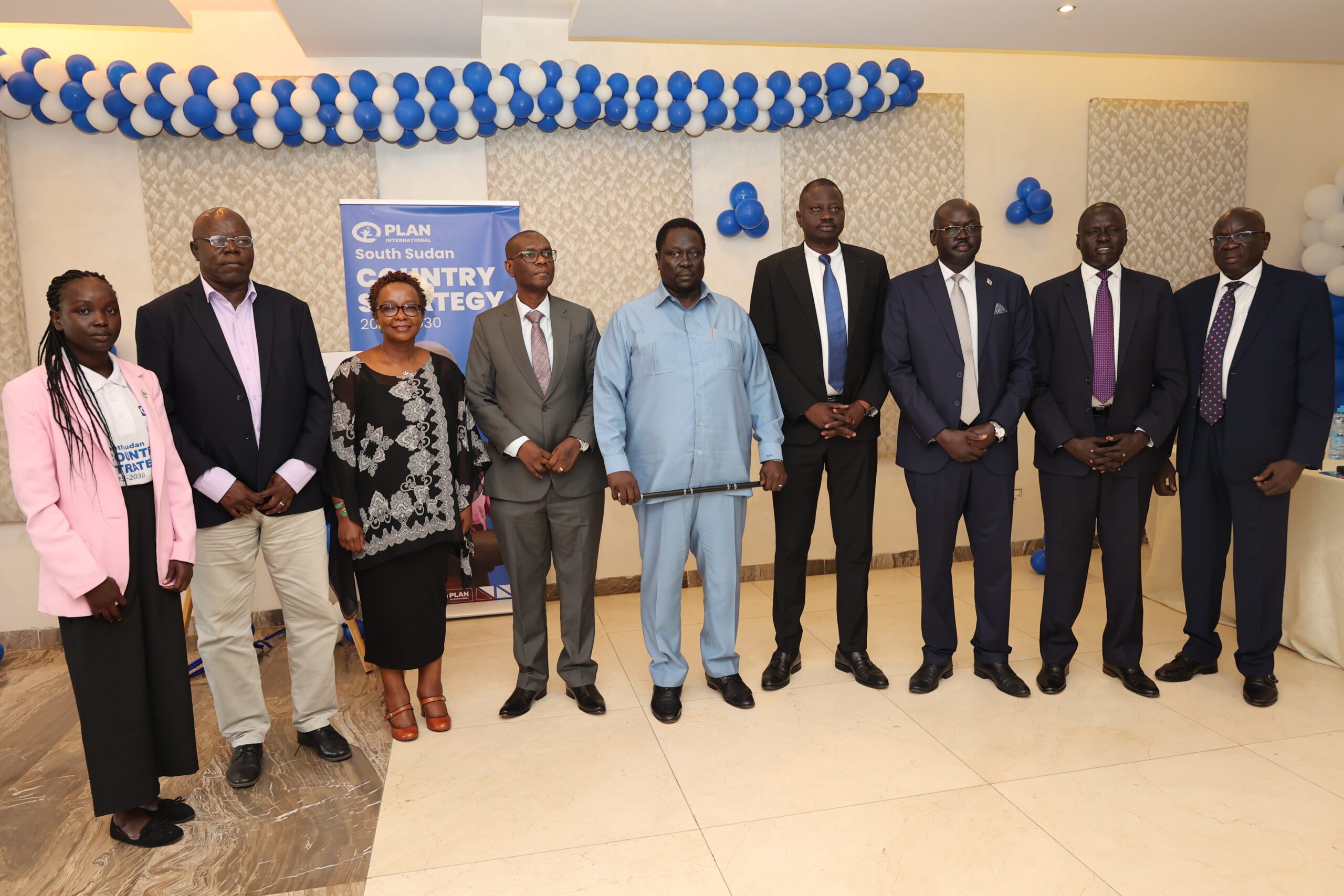Mr. Paul Lusato Plan International South Sudan Country Director standing next to Minister of Agriculture, Food and Security Hon. Hussein Abdelbagi and Mrs. Angela Muriithi Sub-Regional Director together with other government officials for a group photo after the country strategy launch.