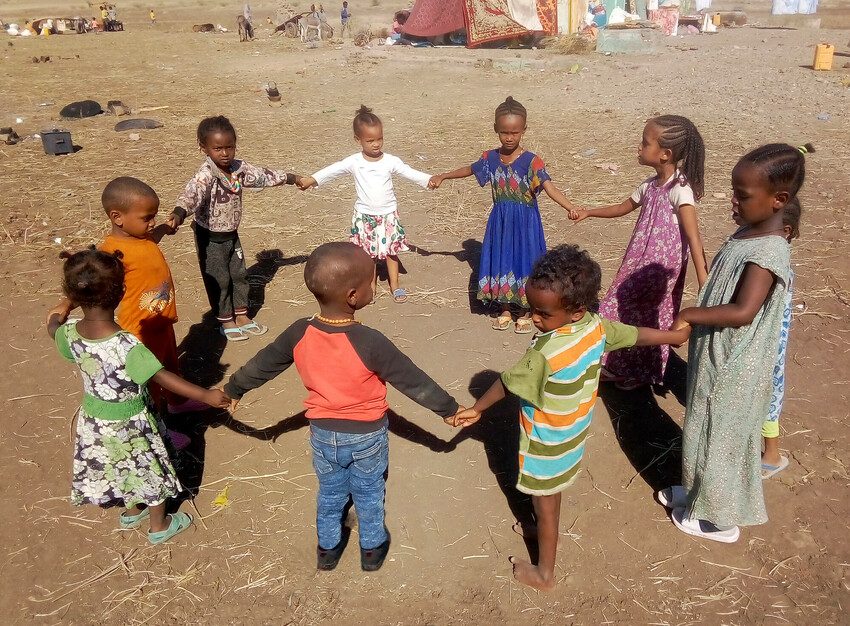 Children playing in a Plan International-run child-friendly space in a refugee camp in Sudan