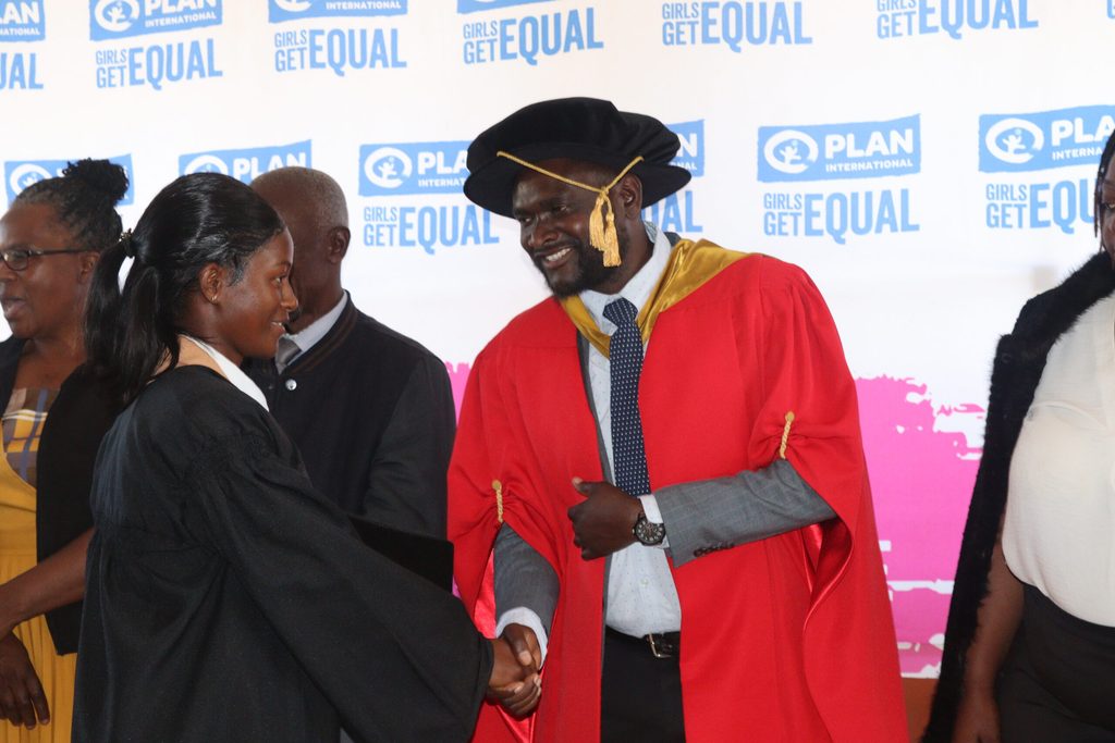 People shake hands at the Digital Skills for Youth project graduation.