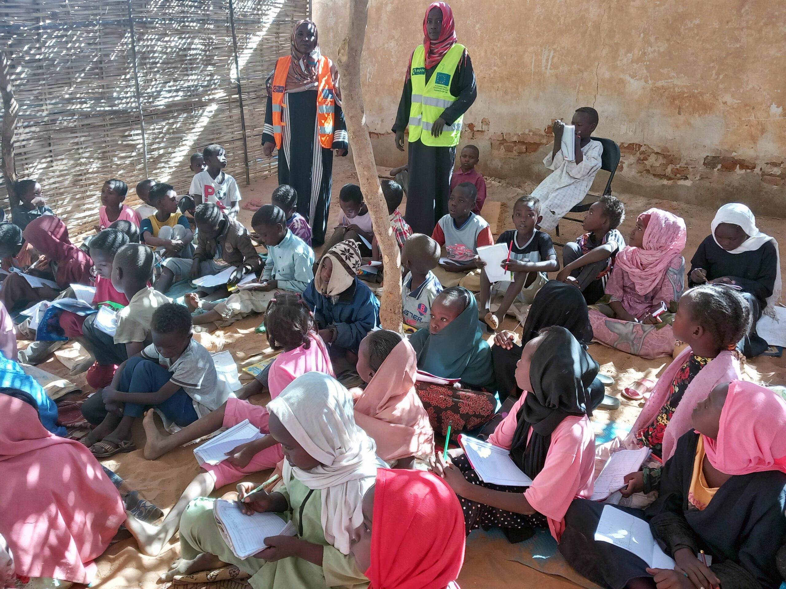 Children learning at a temporary learning centre.