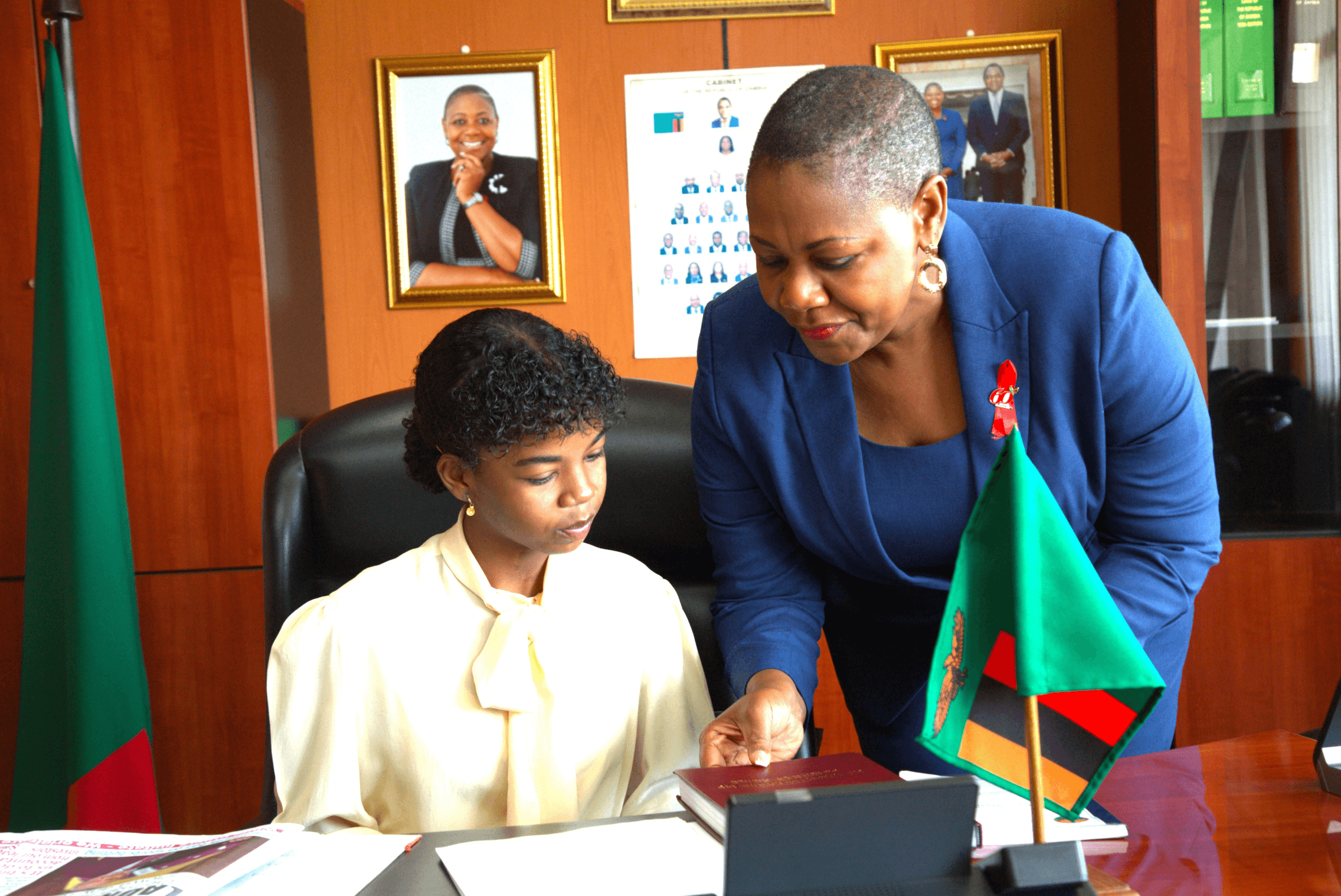 16-year-old Susy from Zambia being guided by Minister of Justice Hon. Kasune during recent international day of the girl #GirlsTakeover