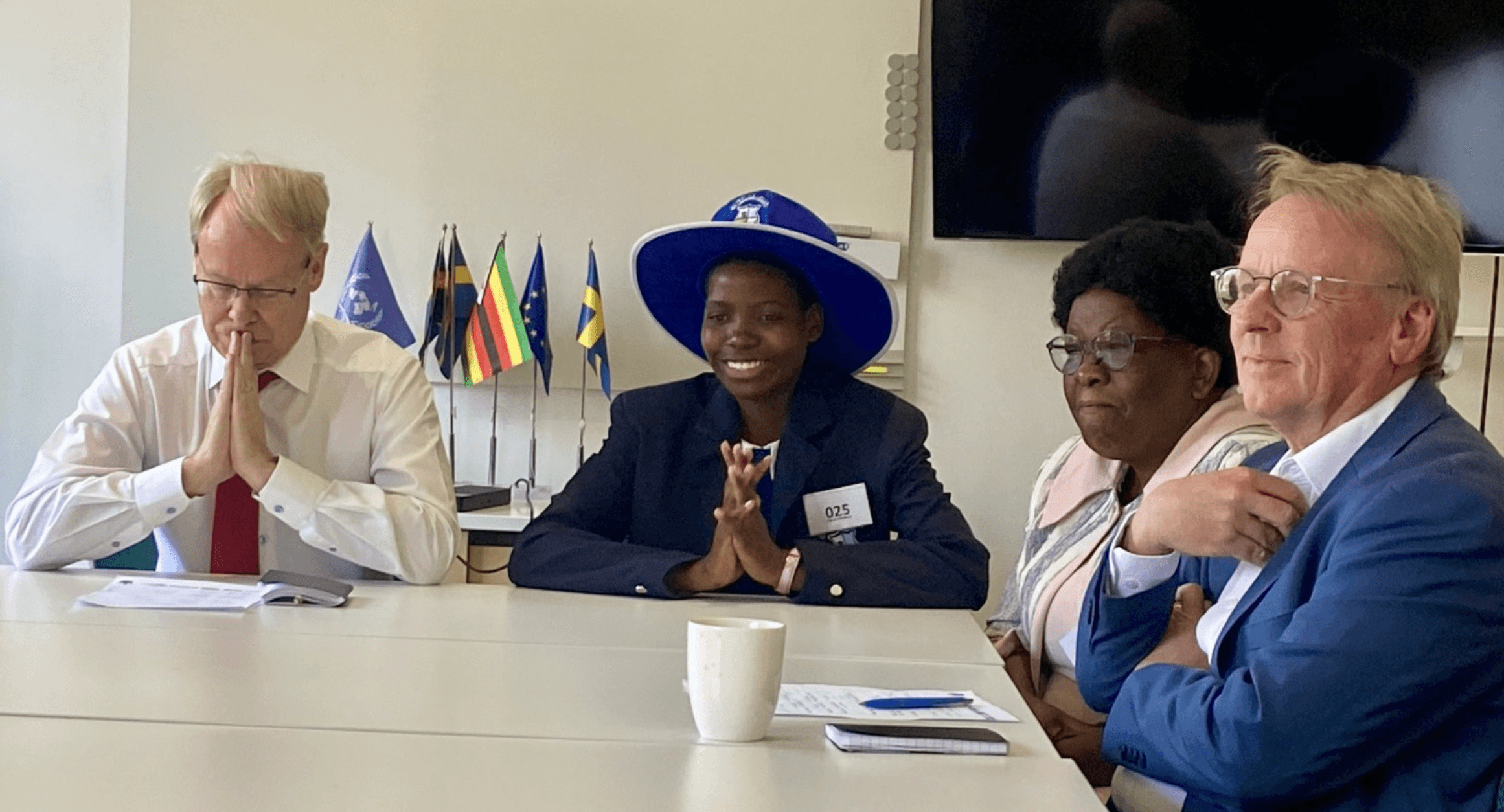 Rebecca from Zimbabwe sits with officials from the Swedish Embassy during recent International Day of the Girl #GirlsTakeover