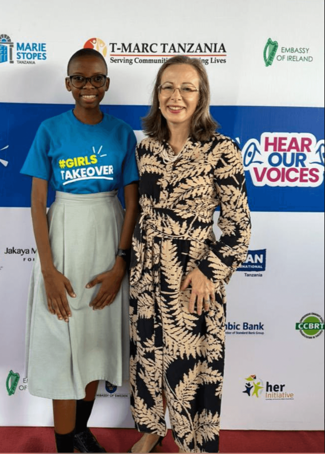 Eighteen-year-old Maureen poses for a picture with Tanzania's British High Commissioner Ambassador Marianne Young during the International Day of the Girl takeover activities