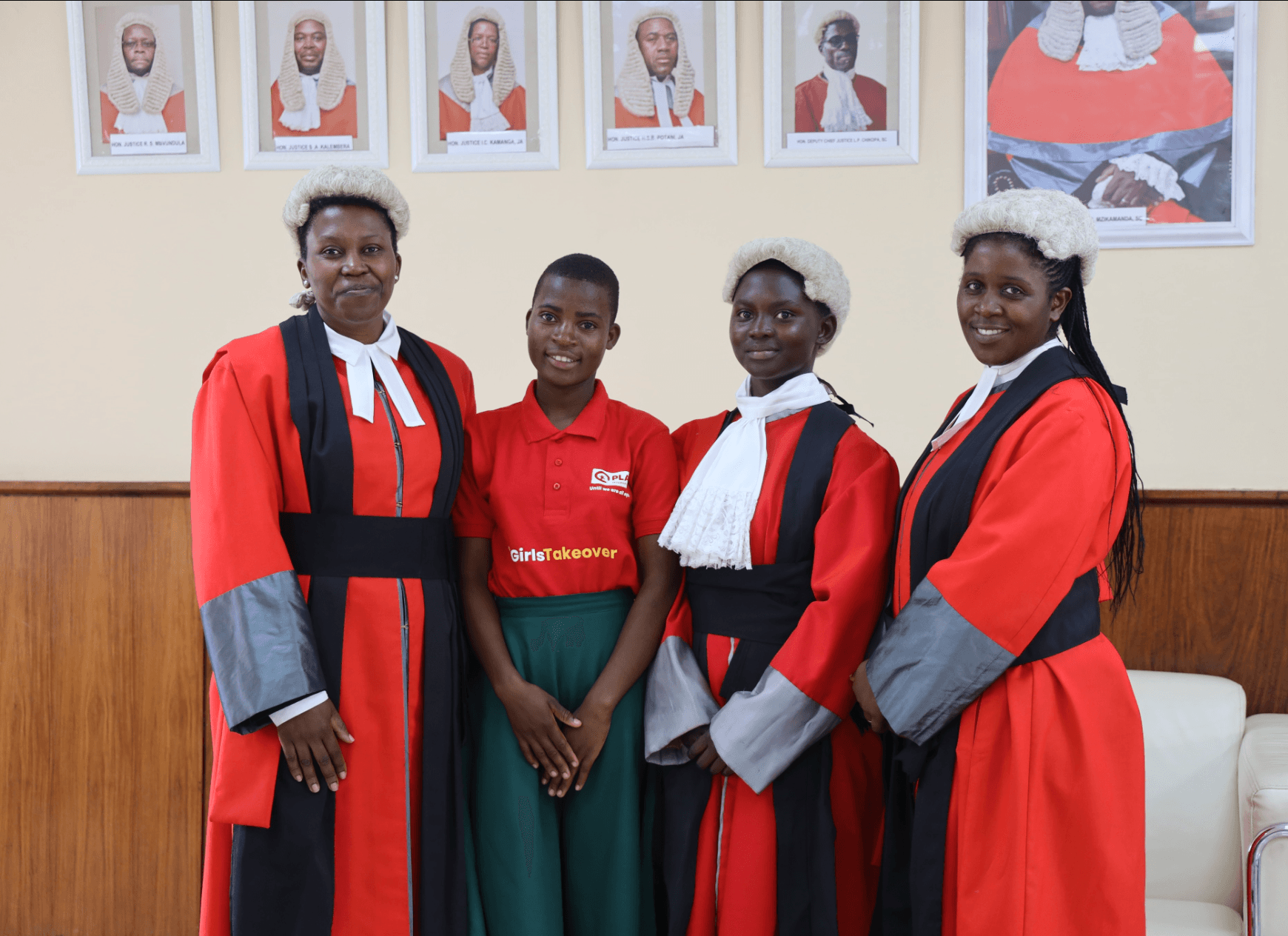 Faith and Christina standing with female high court judges after takeover.