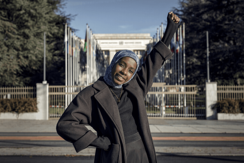 Razan celebrates her campaign's success at the United Nations European headquarters in Geneva.
