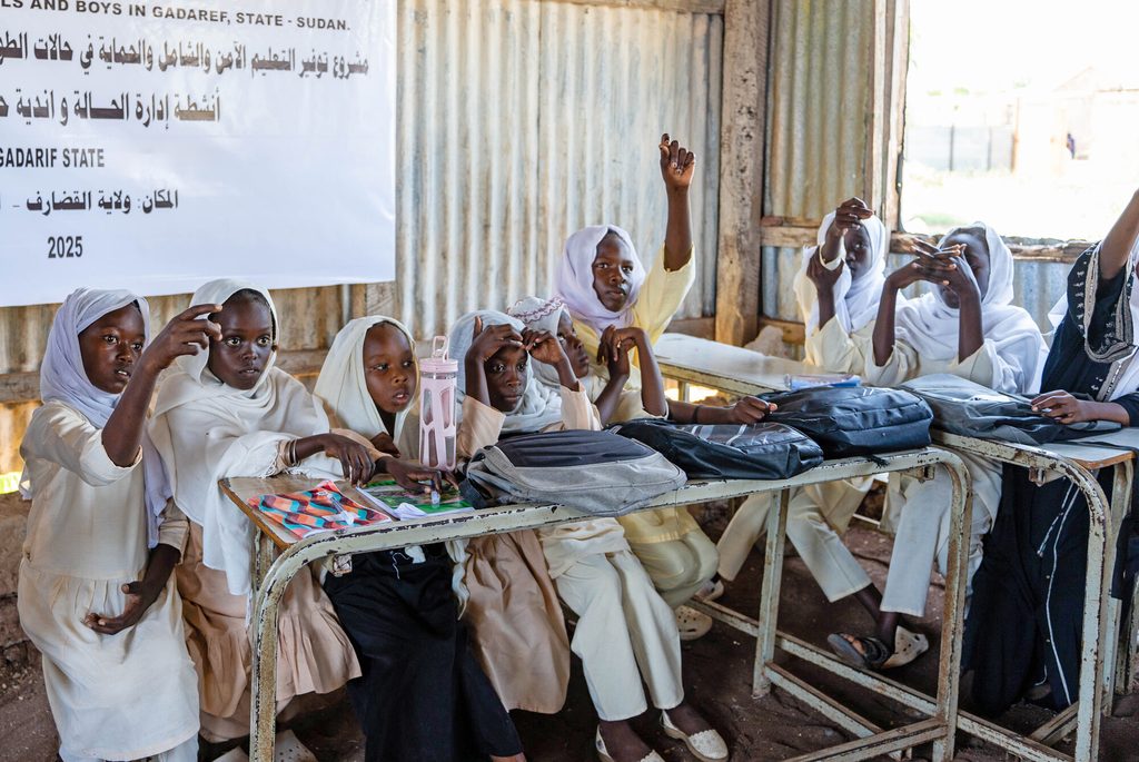 Adolescent girls sitting in class in IDP camp in Sudan