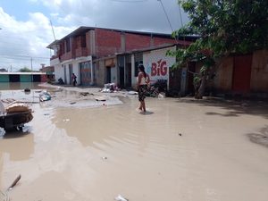 Woman walking through flooded streets