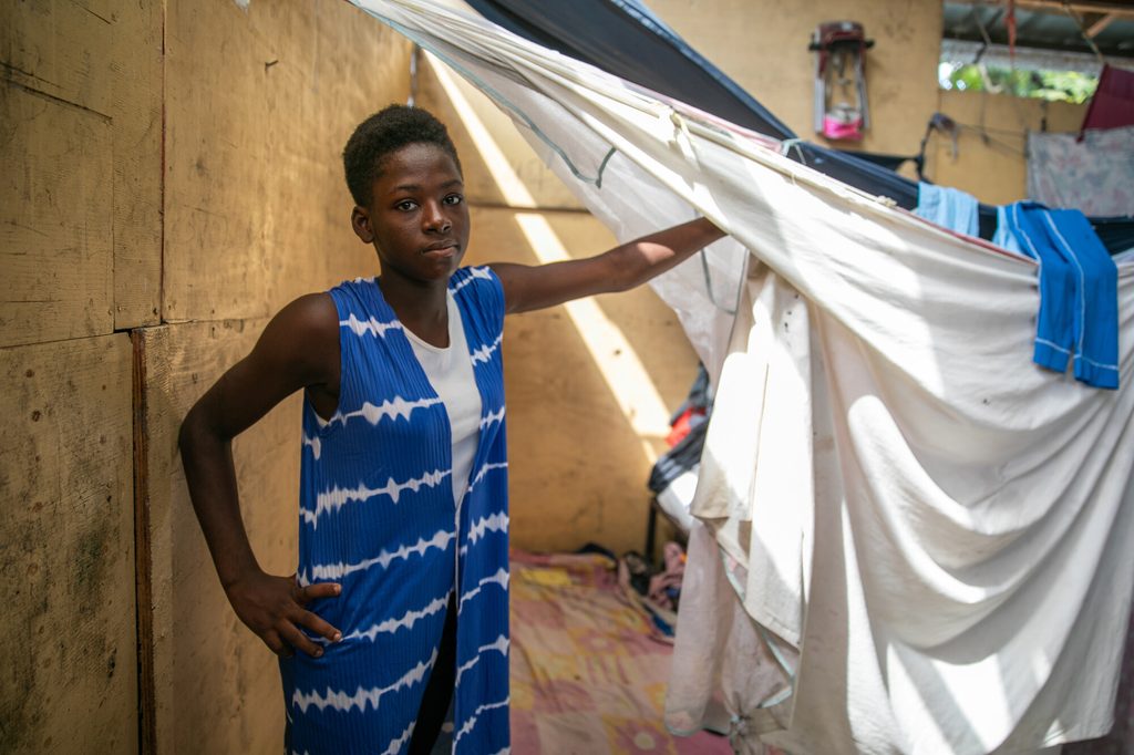 Caroline*, a 15-year-old girl, in her room in a camp for internally displaced people in Haiti.