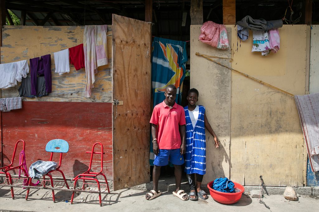 Caroline*, 15, with her brother in an IDP site that used to be a school.