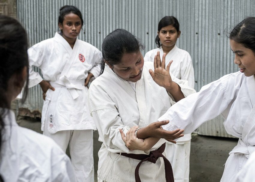 Gaiotree, 24, teaches younger girls in her community karate skills