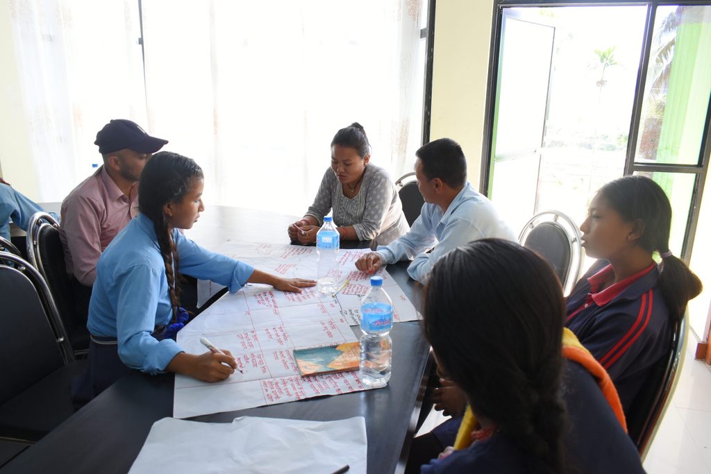 Maya in group work during the development of the learning continuity plan © Plan International