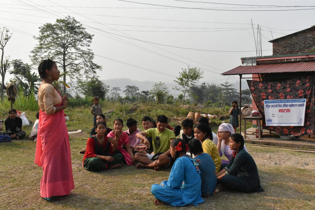 Maya, 15, delivering a session on DRR/CCA in her community © Plan International