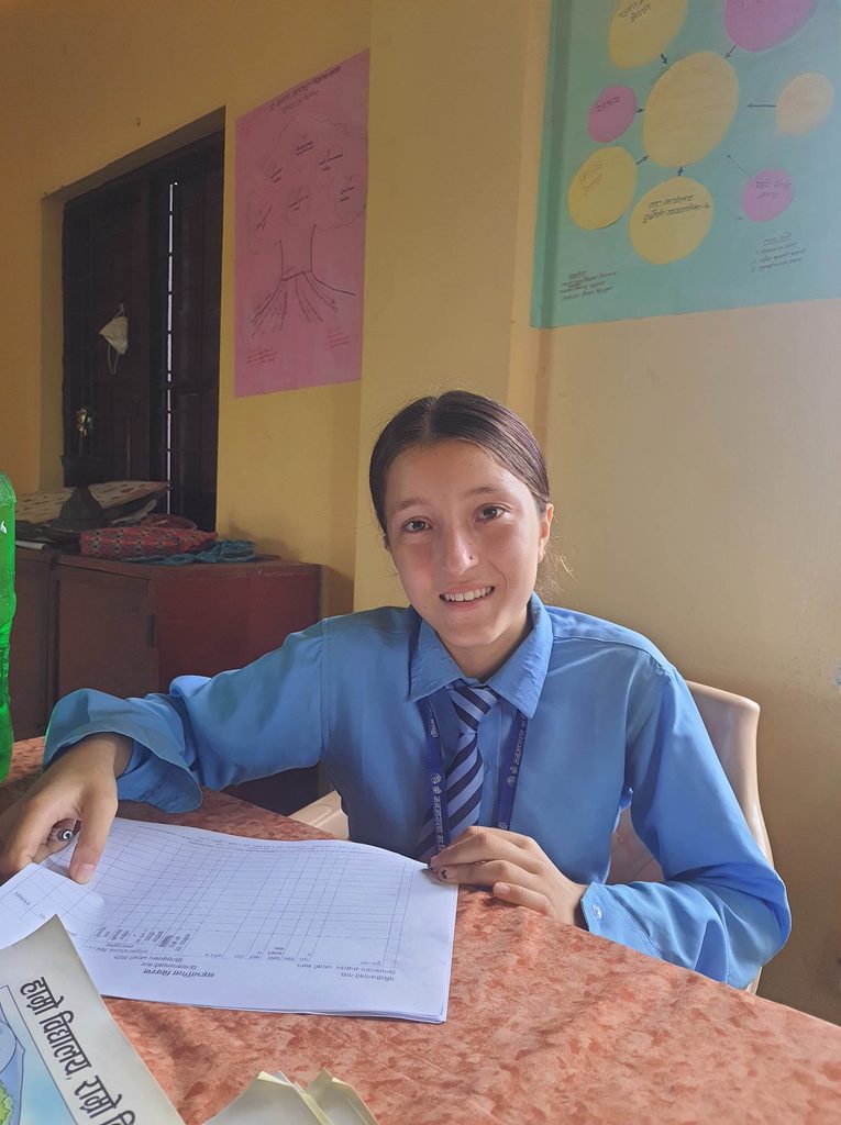 Juna, 15, School Safety Champions preparing attendance sheet © Plan International