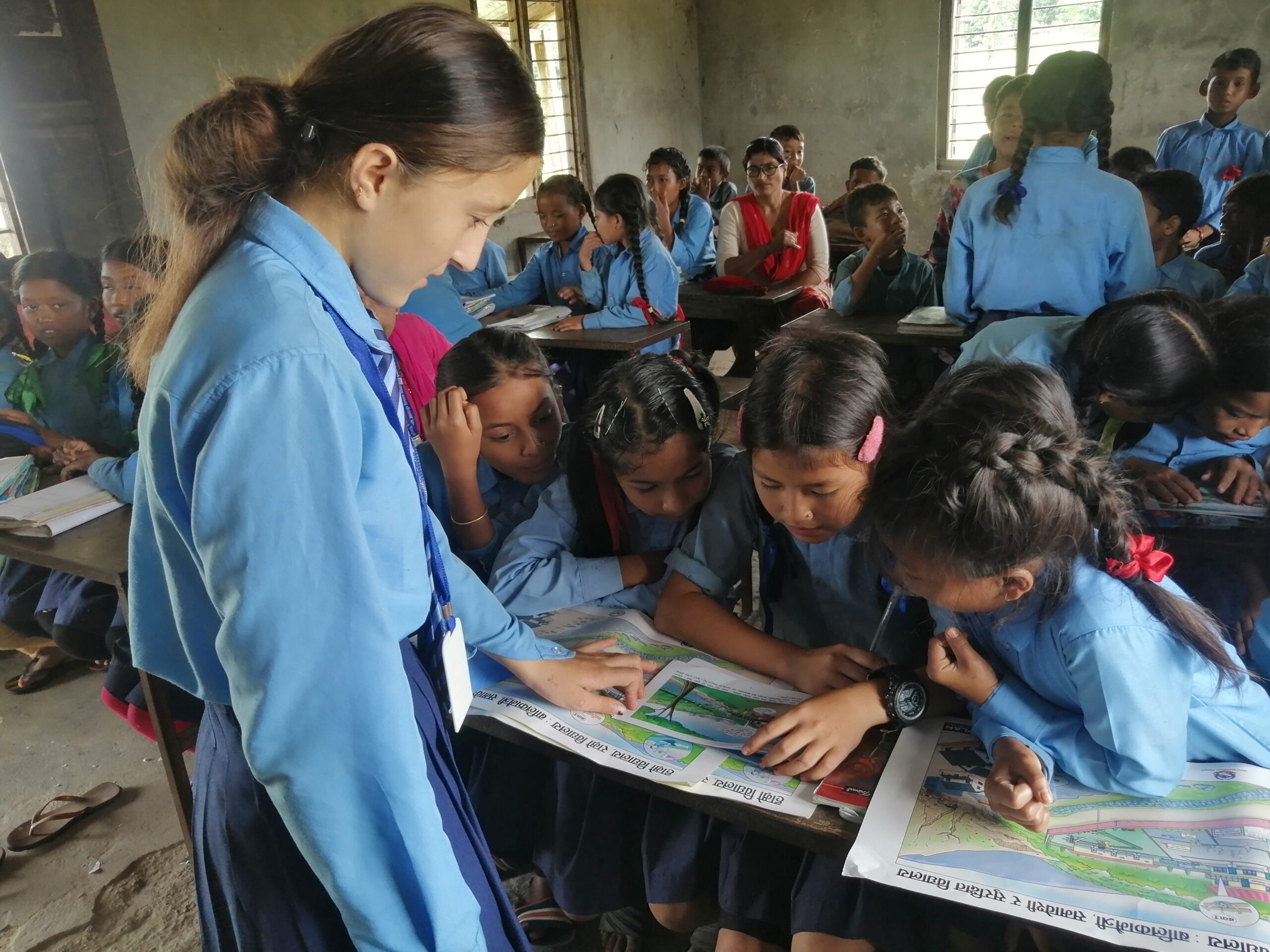 Juna leading a DRR/CCA learning session © Plan International