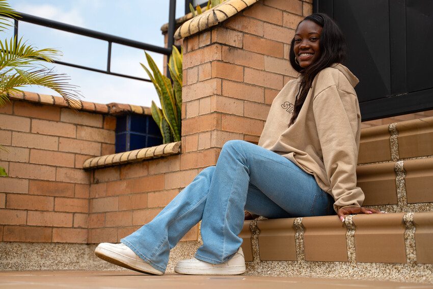 Laudbry sitting on some steps. 