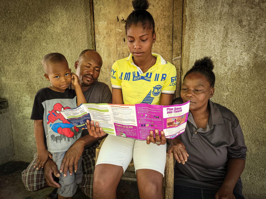 Girl with her family in Haiti.