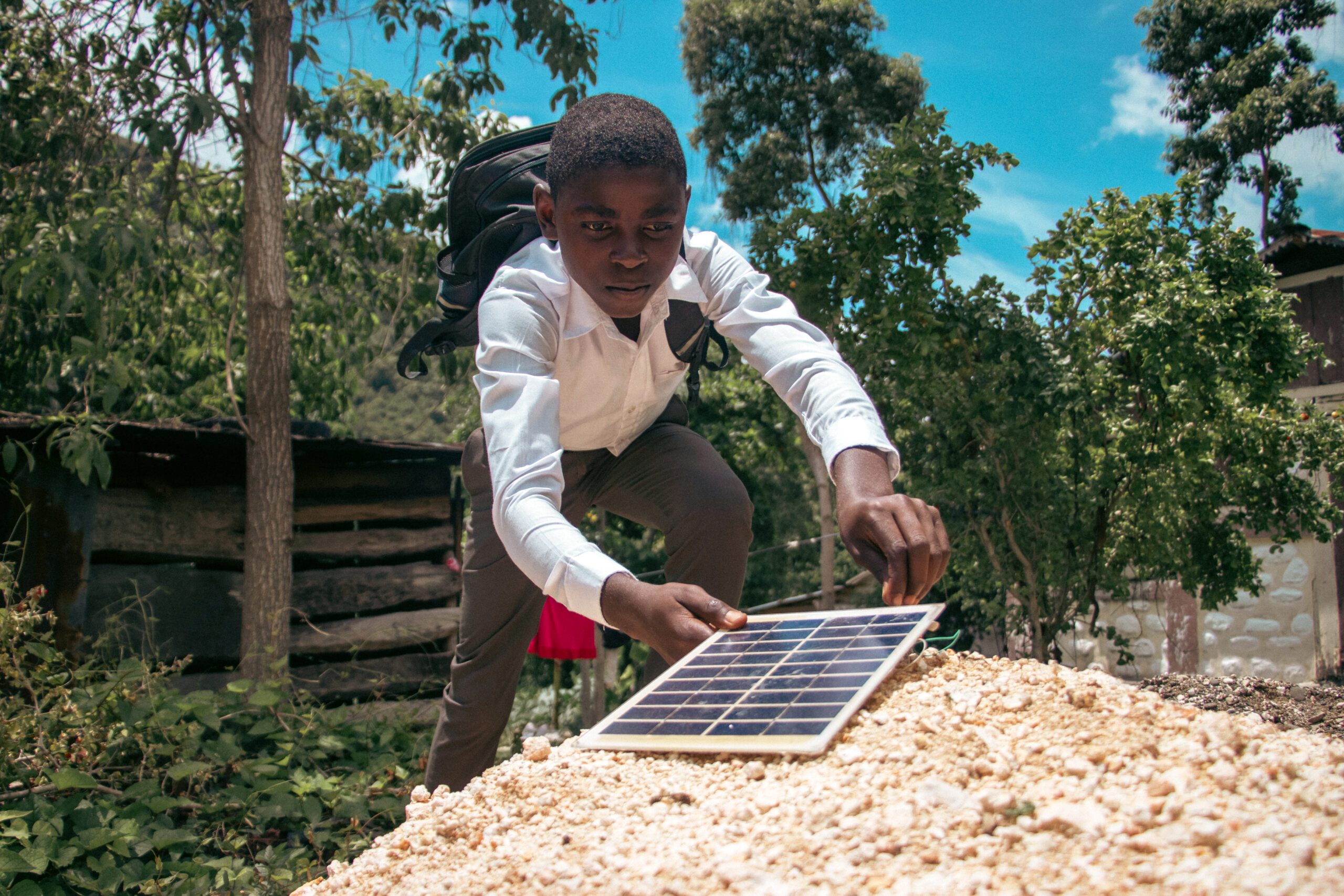 Oldsen using a solar panel to generate electricity.