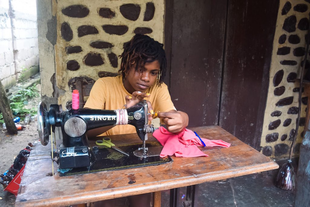 Stephanie learning tailoring skills