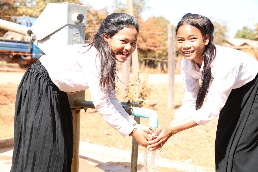 Girls wash their hands at school supported by Plan International