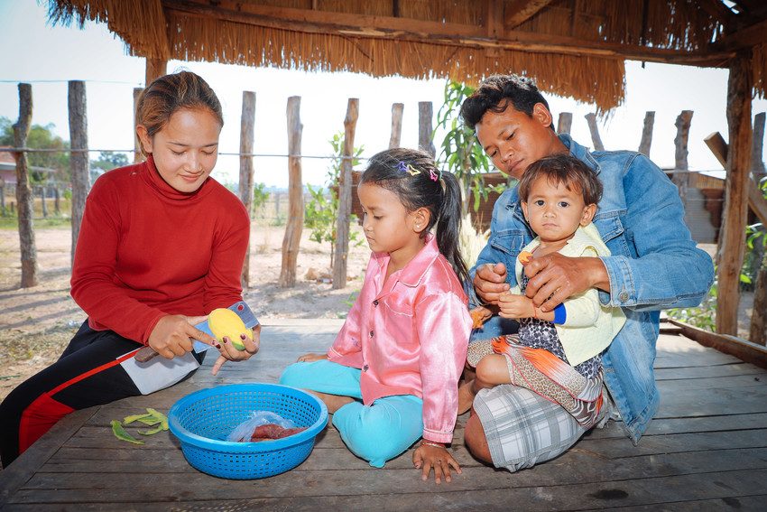 A family prepares a meal in Siem Reap