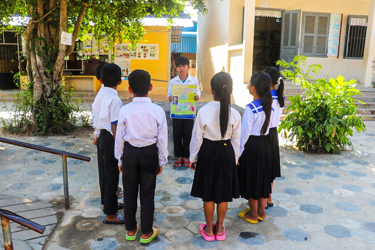 Sokha is explaining team about evacuation and disaster maps