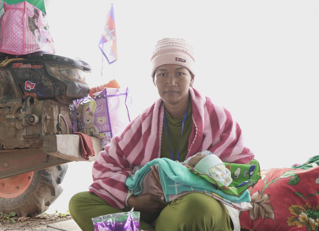 A displaced woman with her new born son in Preah Vihea province