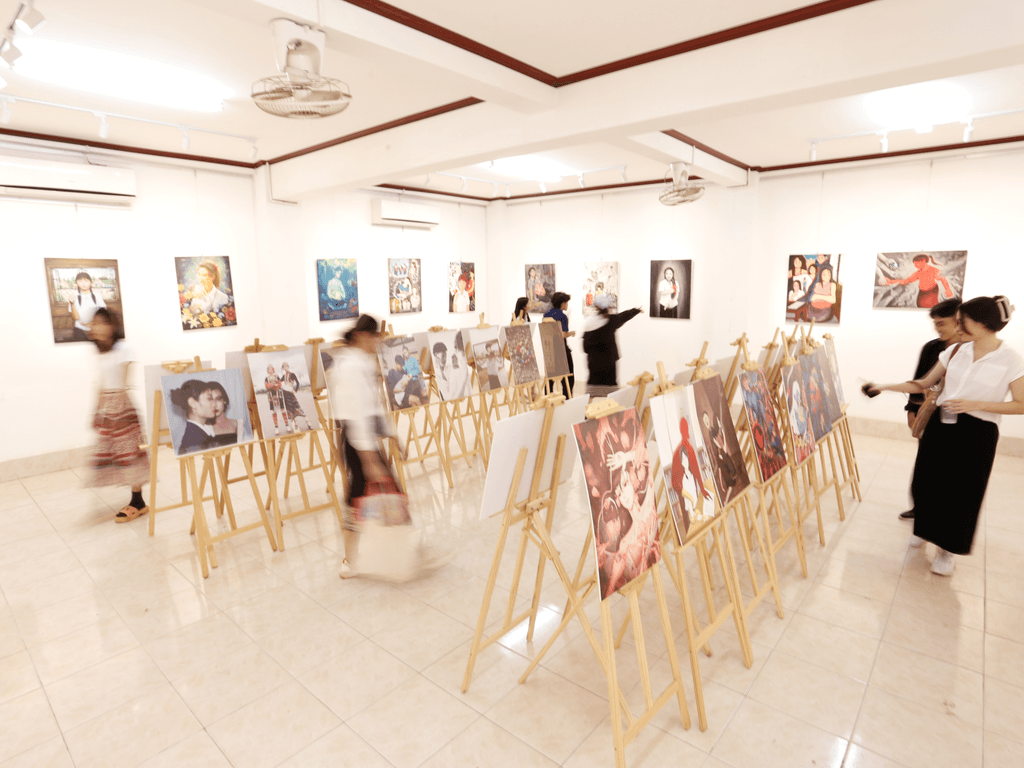 Exhibition event showcasing all the artworks submitted to the art competition on their easels.