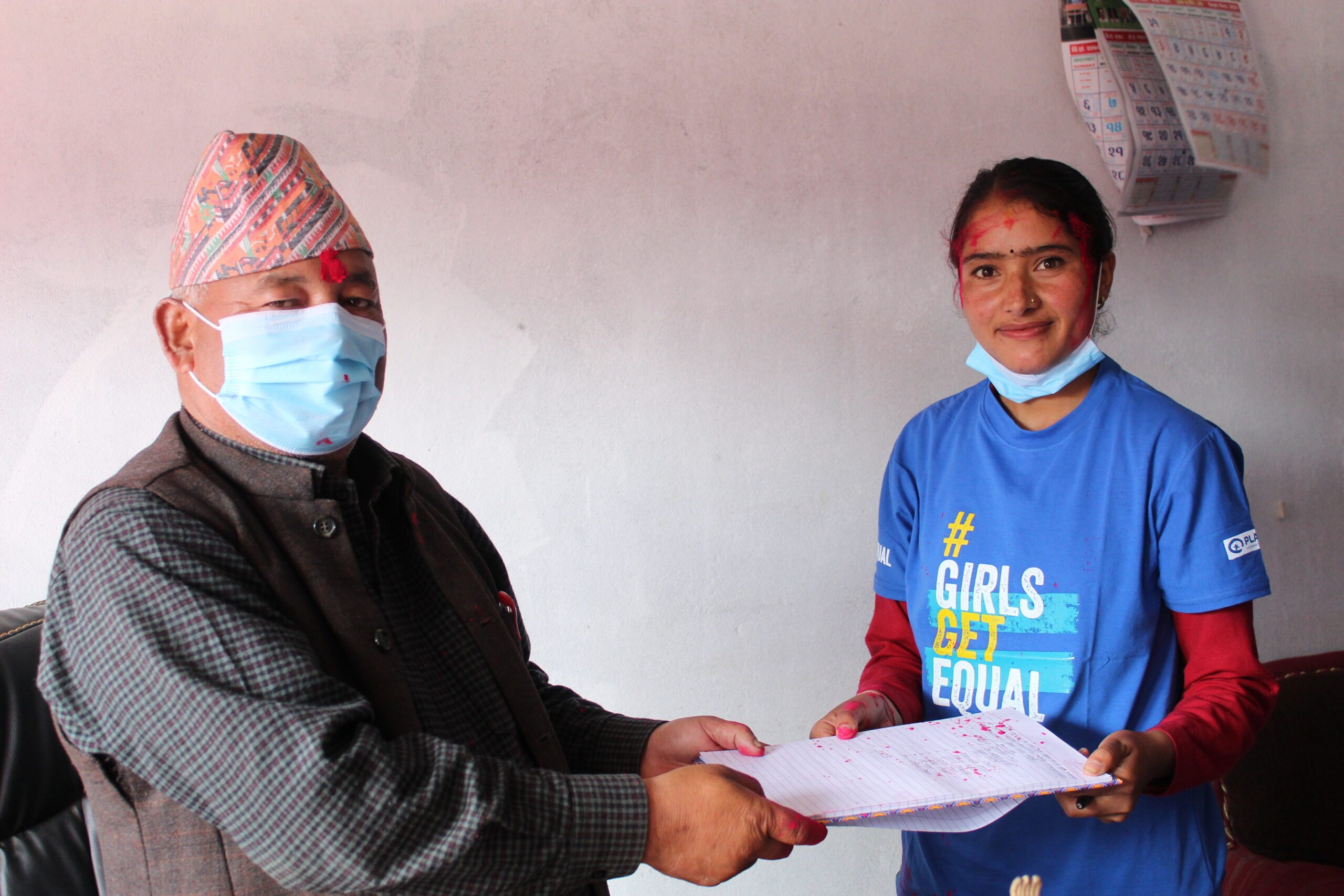 The Chairperson of Sinja rural municipality handing over a commitment letter to work with girls to fight against online abuse