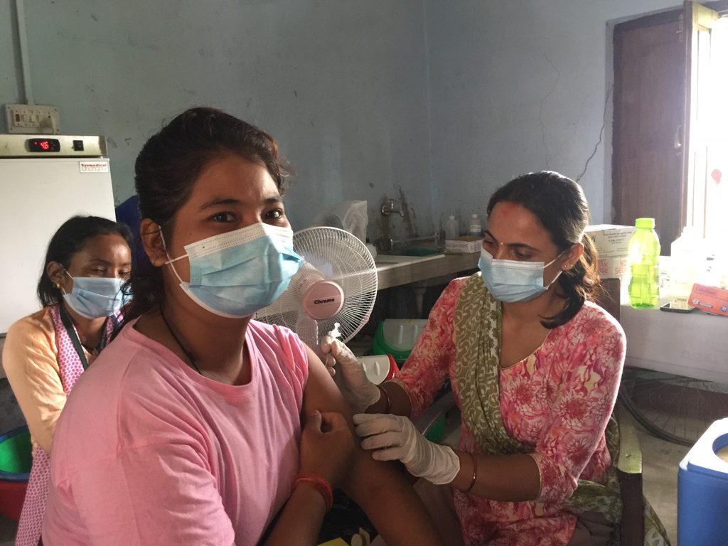Samjhana receiving her COVID-19 vaccine