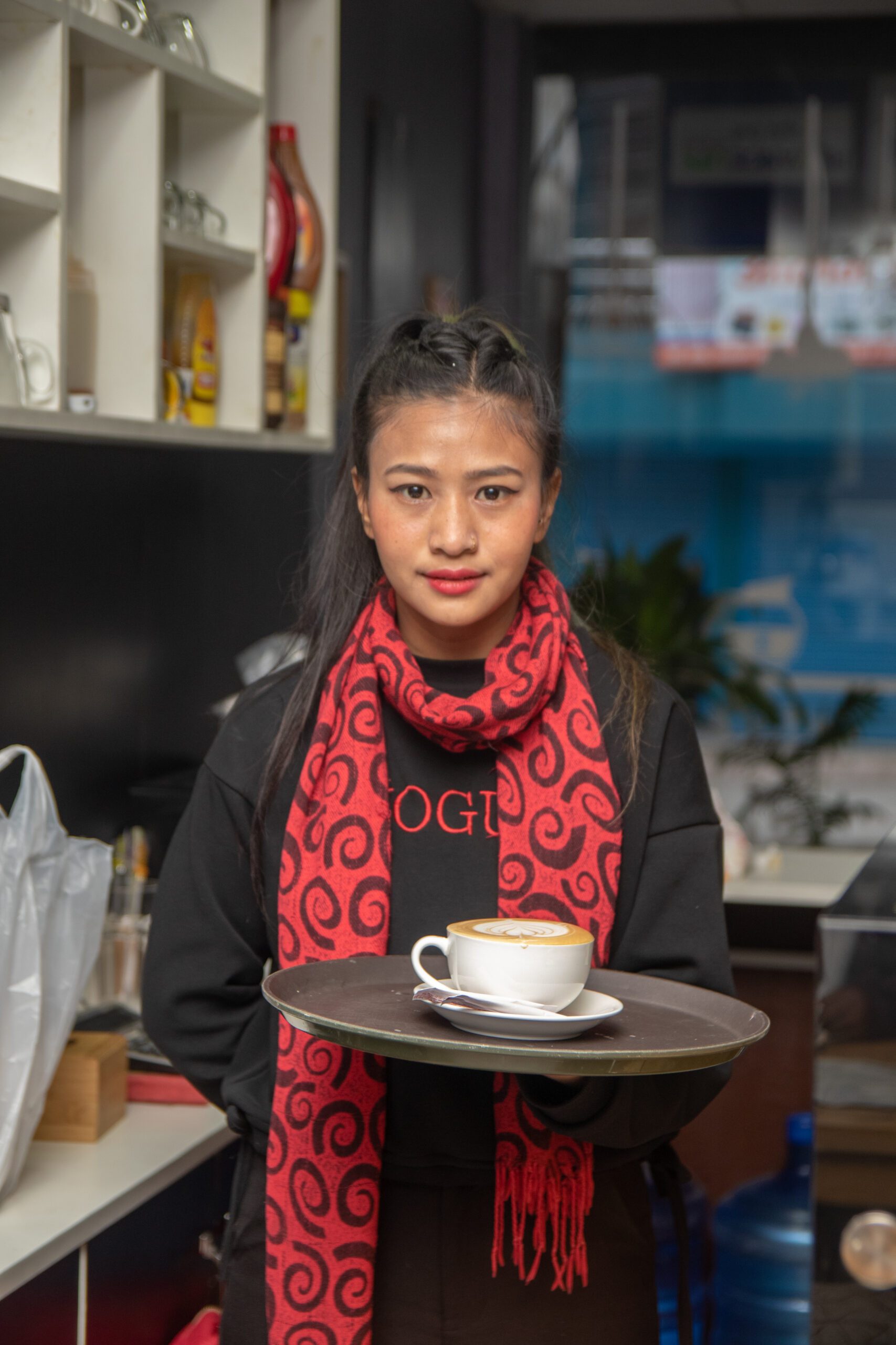 Urmila working at a cafe.