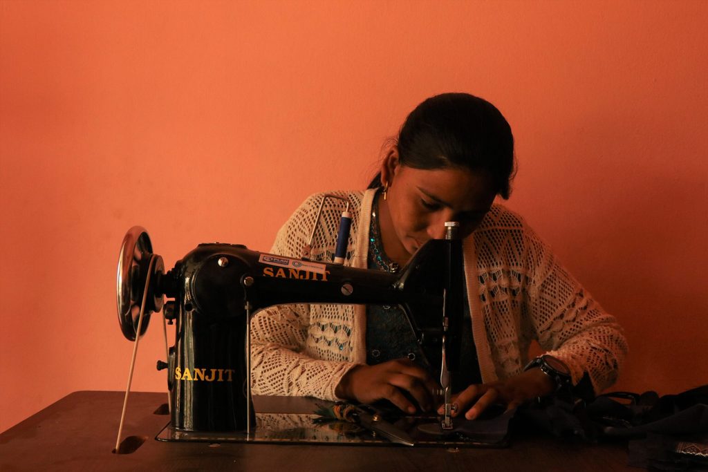 Sima using her sewing machine