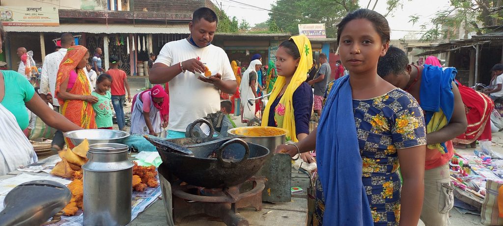 Sakuntala running her tea shop in a market