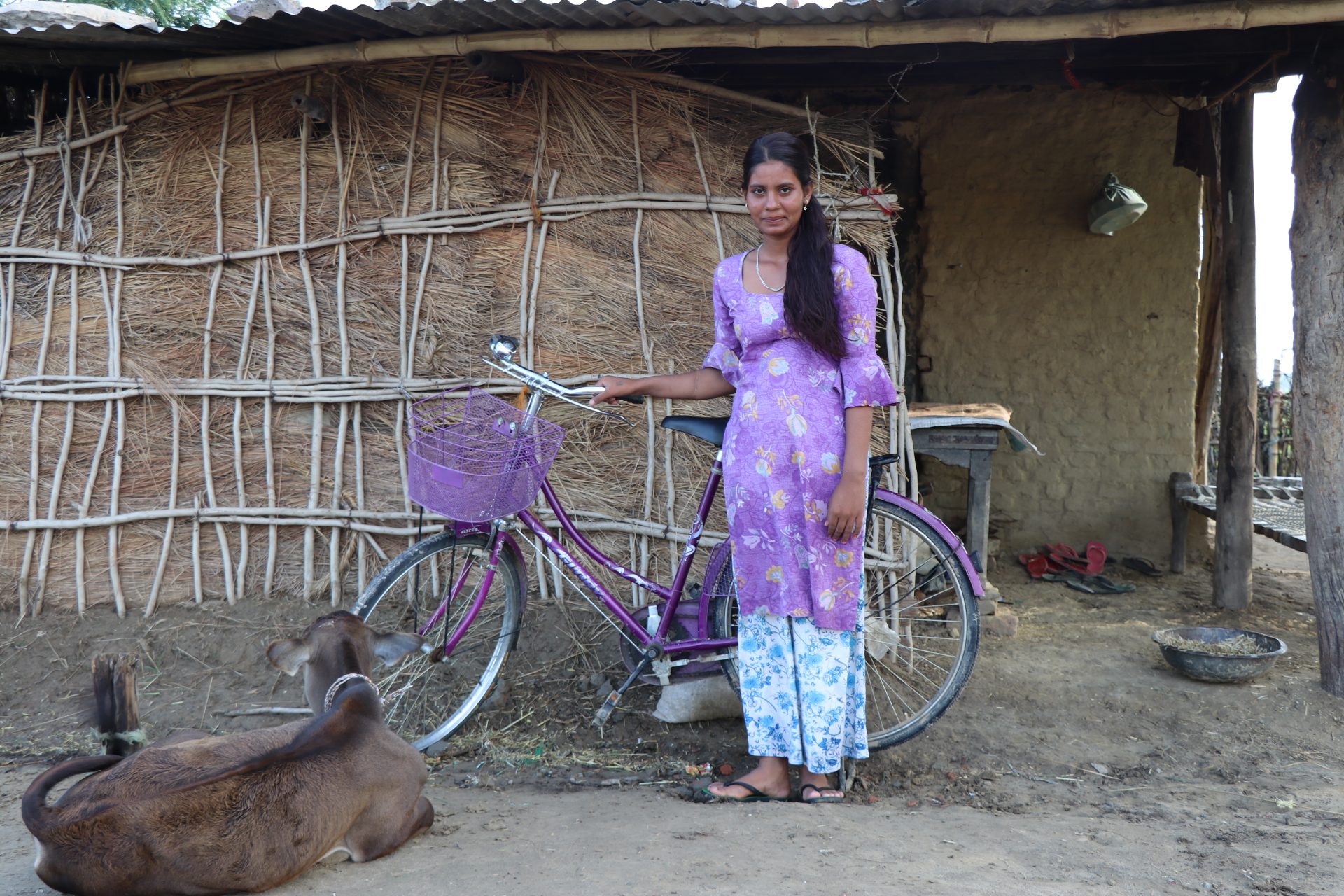 Parbati in front of her house