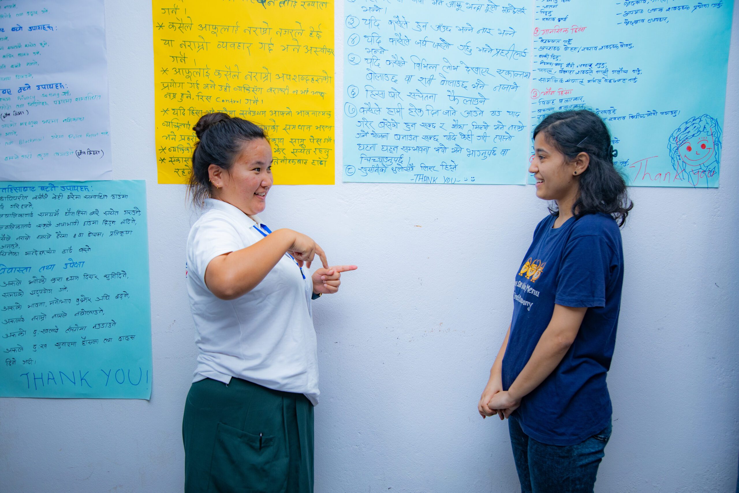 Sabitri with a sign language interpreter during a training session