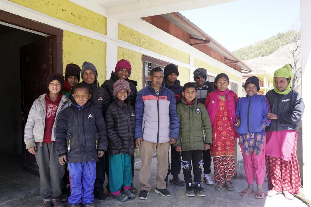 Shailendra and his classmates outside their school which is now more accessible thanks to Plan International Nepal