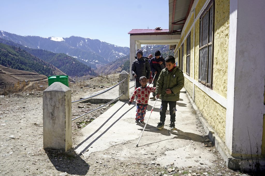 Shailendra walking around the school grounds