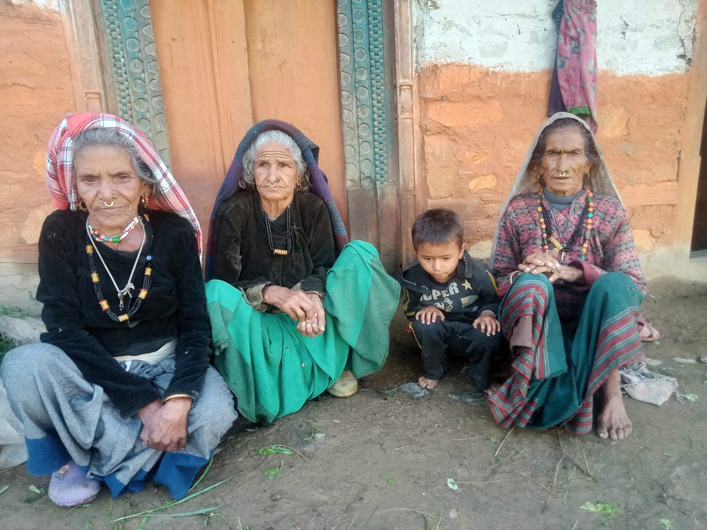 Suwa (centre-left) with her grandson and friends