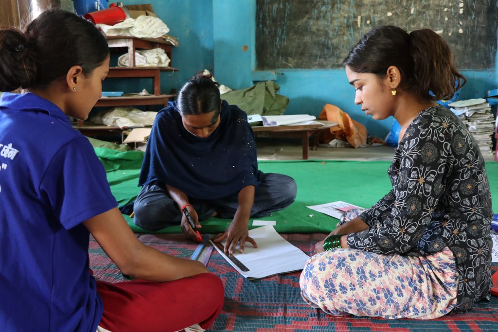 Radhika making reusable sanitary pads with her friends