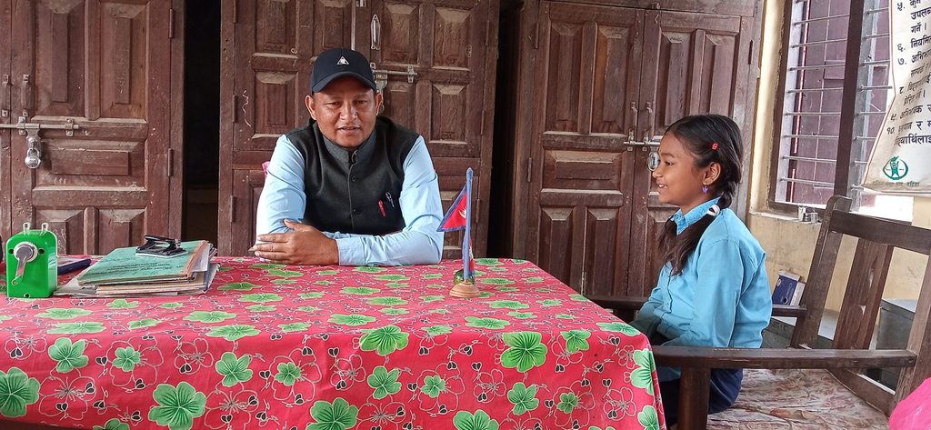 Anisha discussing her school's shortage of sanitary pads at her local municipality office