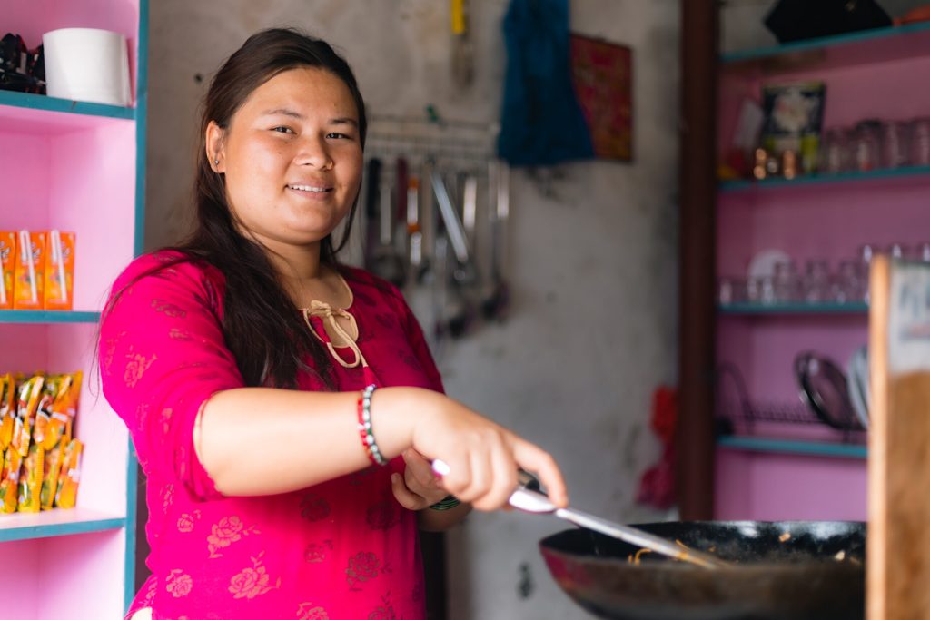 Sapana in her small restaurant preparing lunch for her customers. 