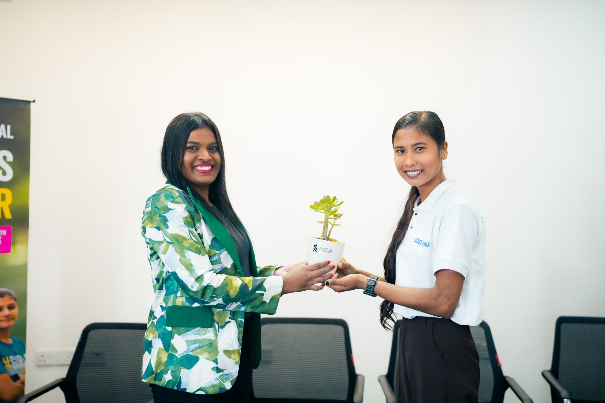Akriti receives a plant as token of love from Standard Chartered.